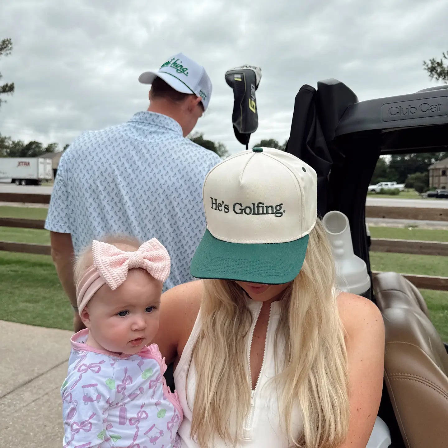 He's Golfing Trucker Hat