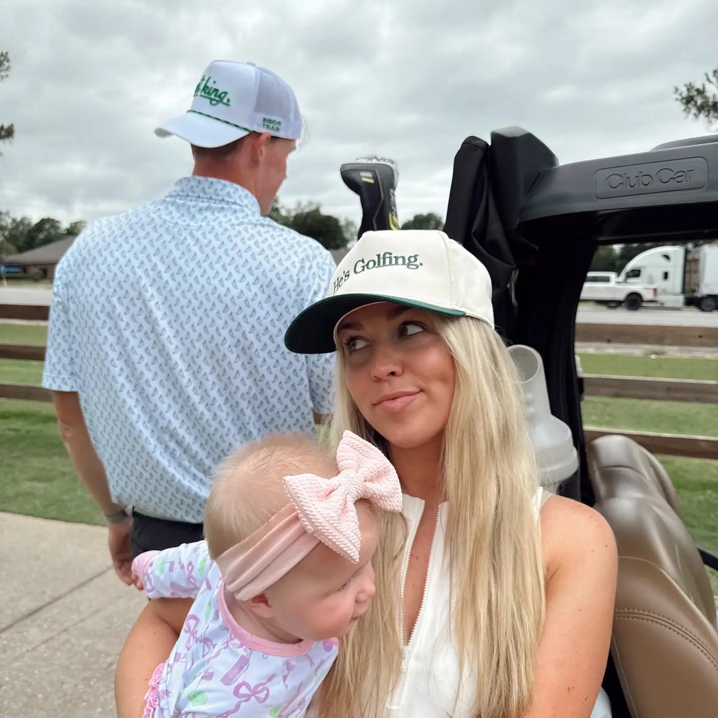 He's Golfing Trucker Hat